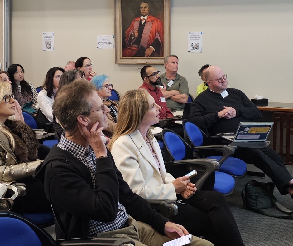 Audience listens to lecture intently