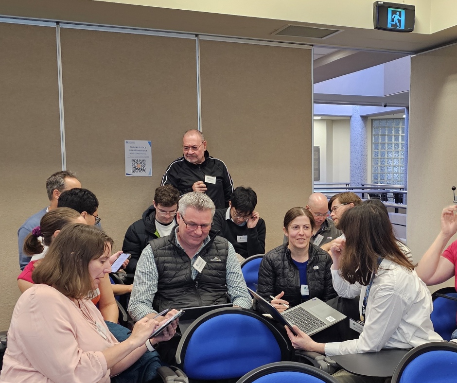 Group of 5 people discussing cases