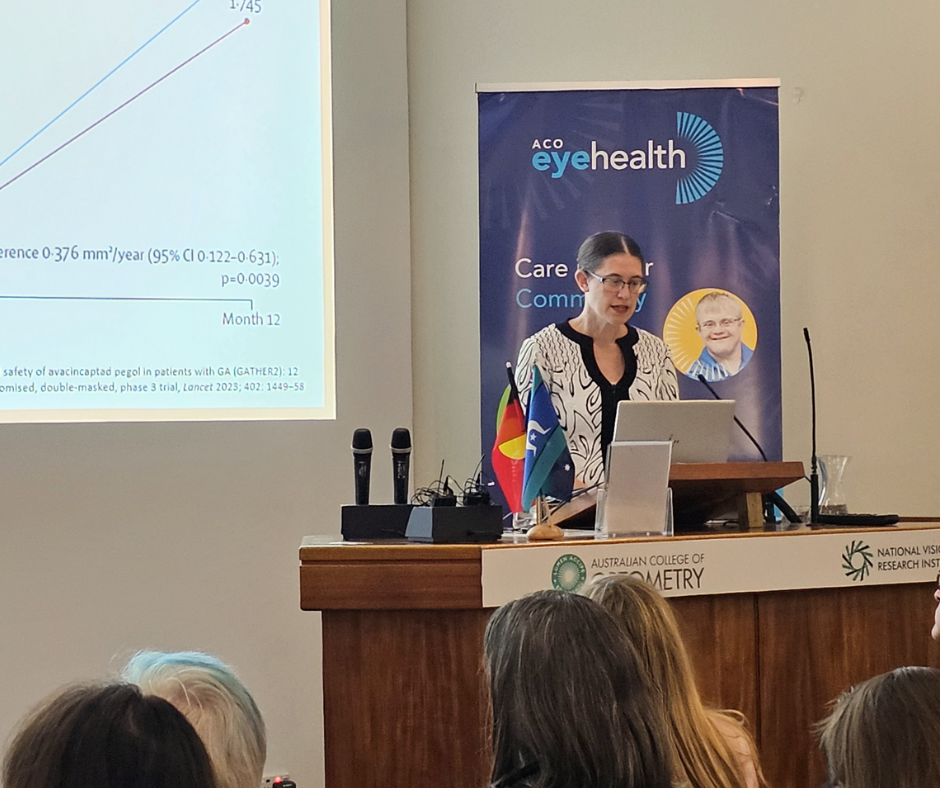 Another woman with glasses delivering a lecture.