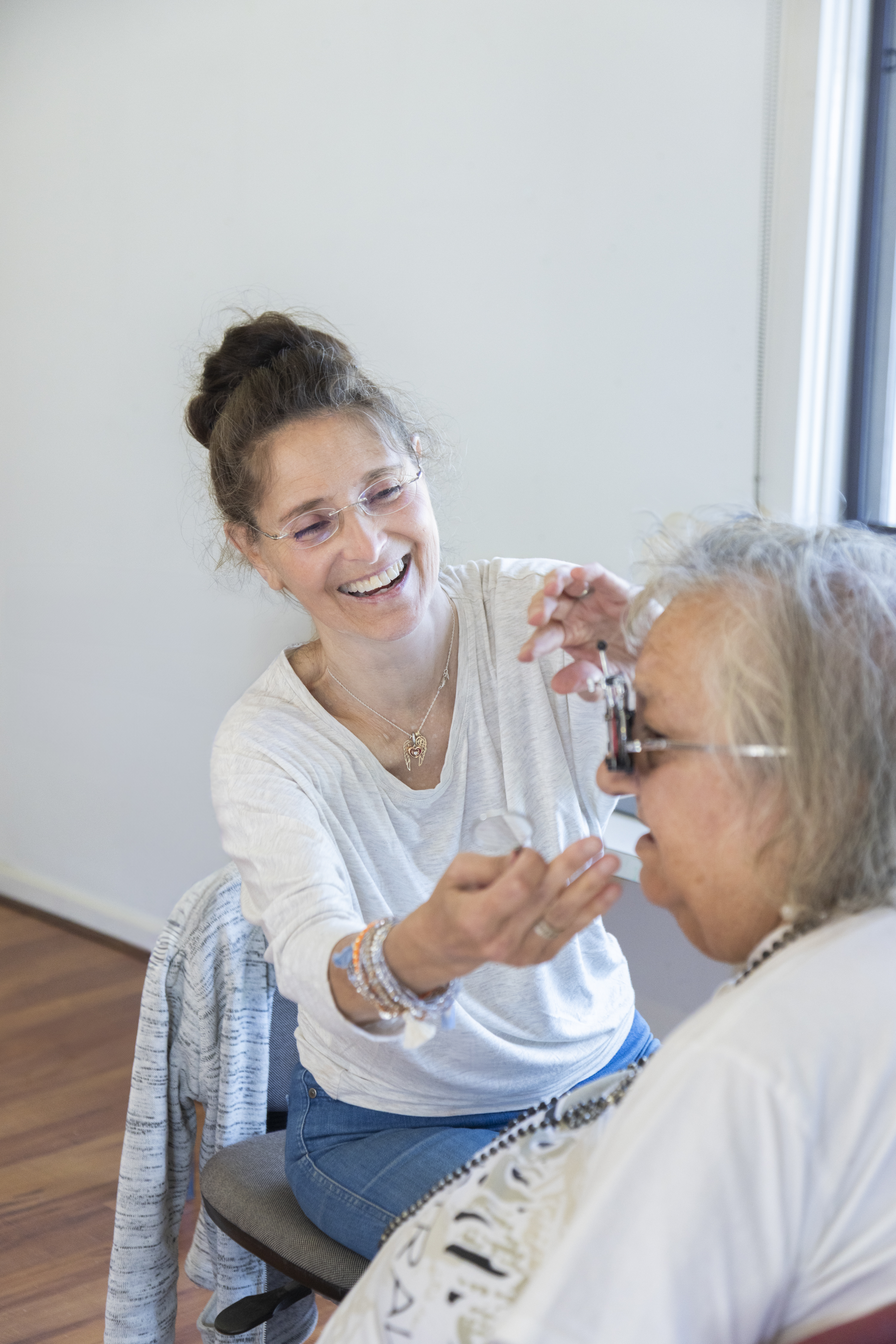 optometrist smiling at patient
