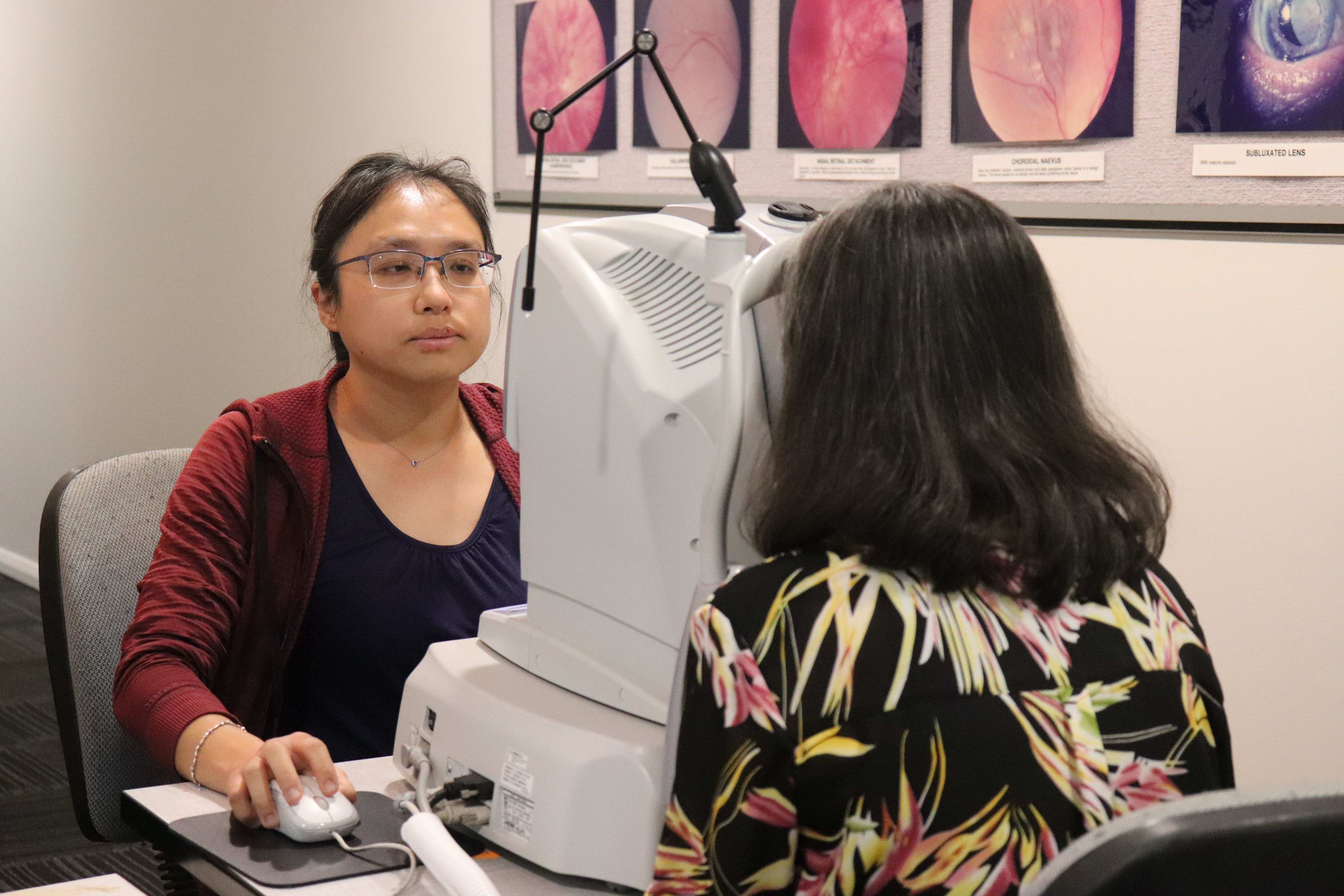 Optometrist conducting an eye scan on pateint